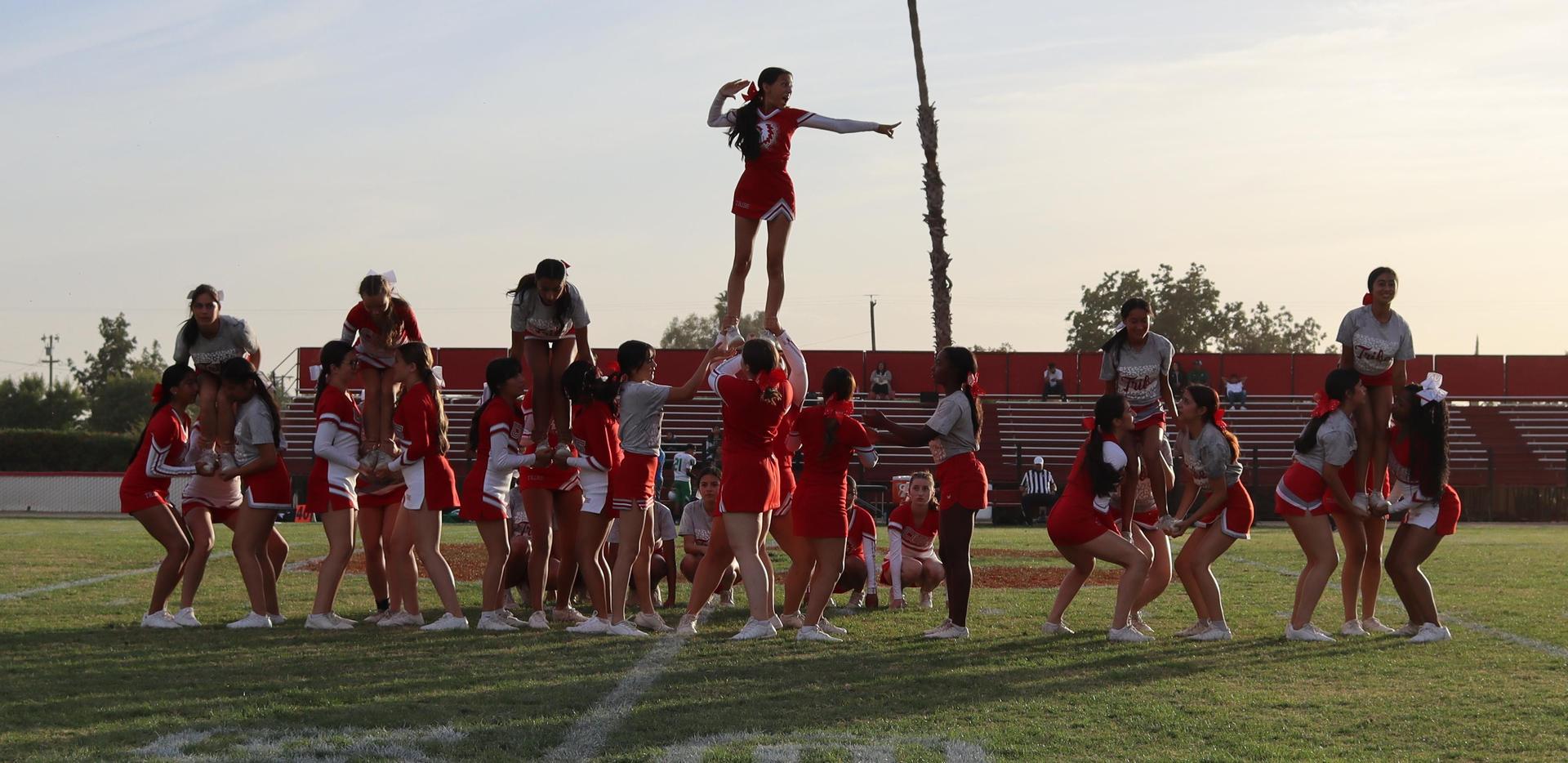 Combined cheer performing at halftime of the football game