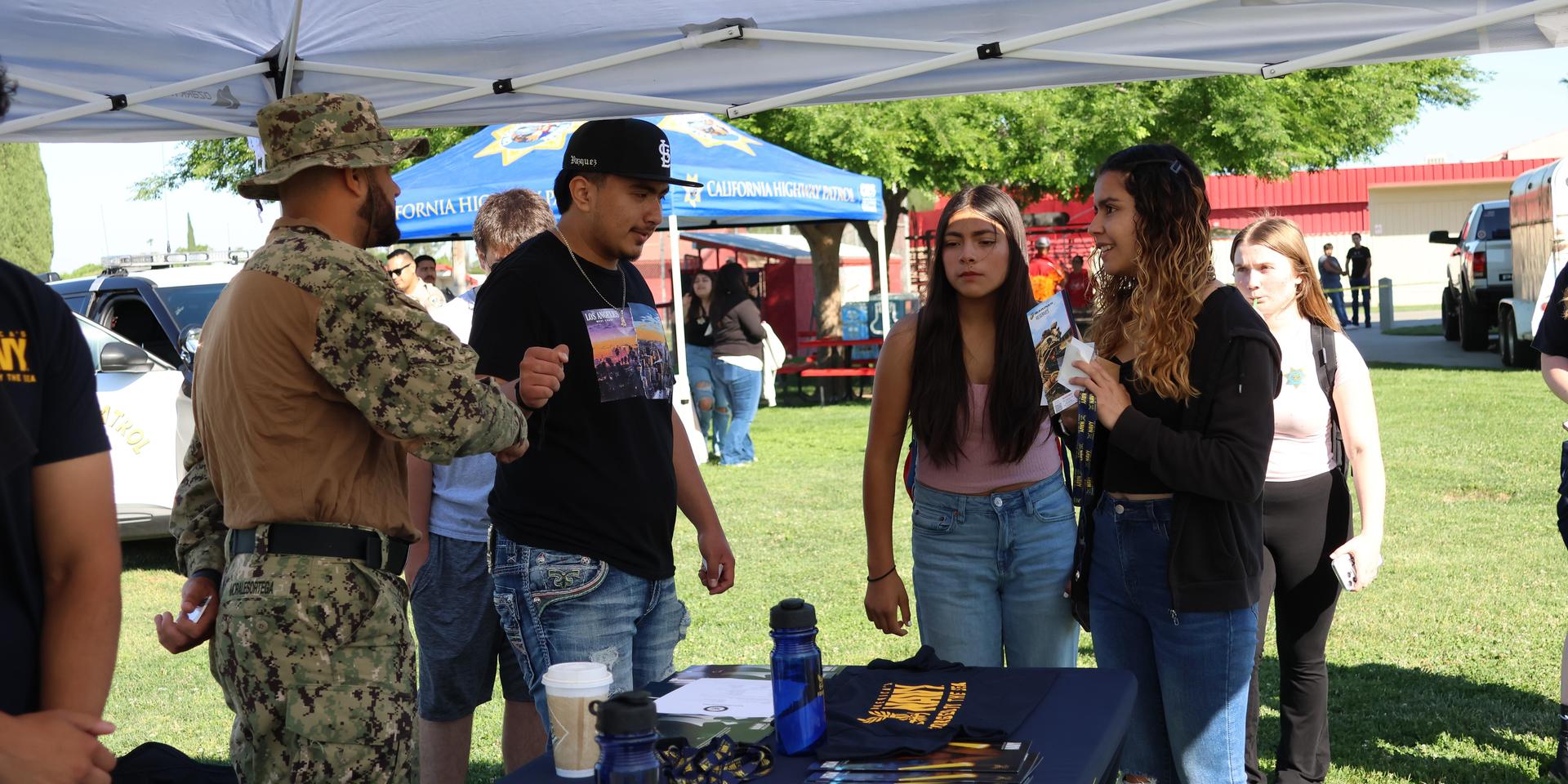 Navy recruiters speaking to students