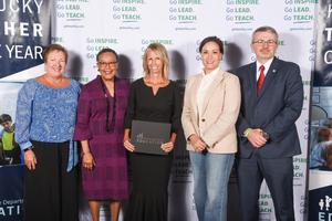 Dowdy pictured with state dignitaries upon receiving High School Teacher of the Year Award.