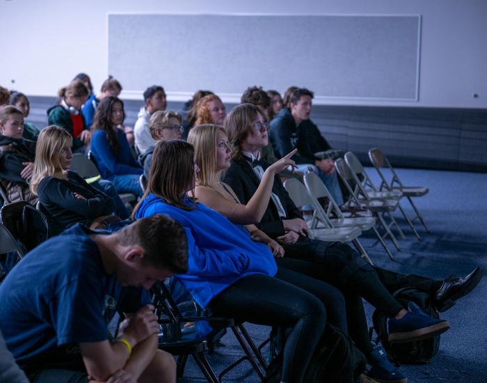 students look at slide