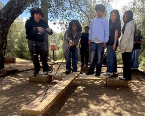 Students work together to create a simple bridge