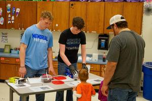 Memorial FFA students assist in station at Legacy Family STEAM Night