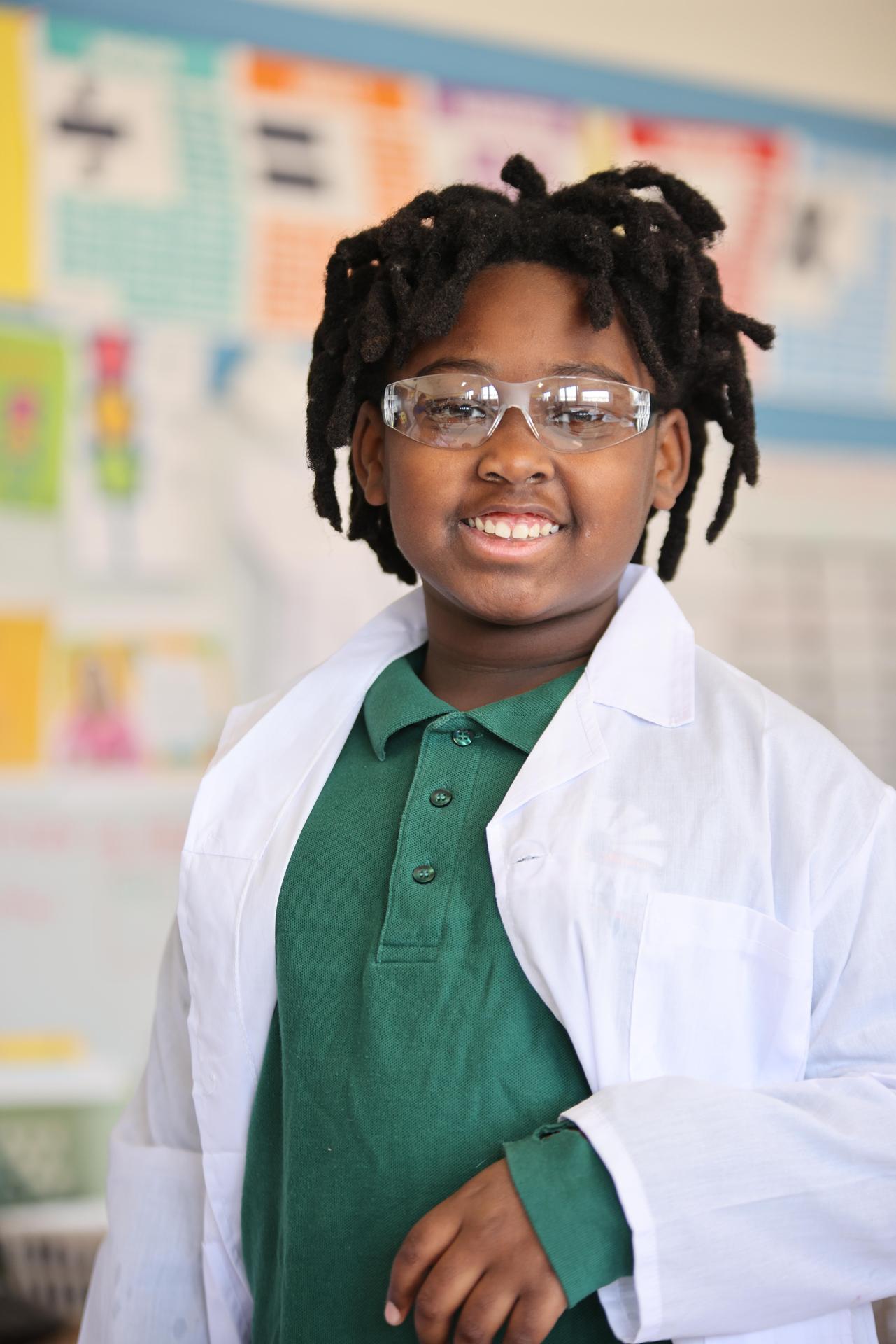 HSA Davenport student writing at a desk in a classroom setting