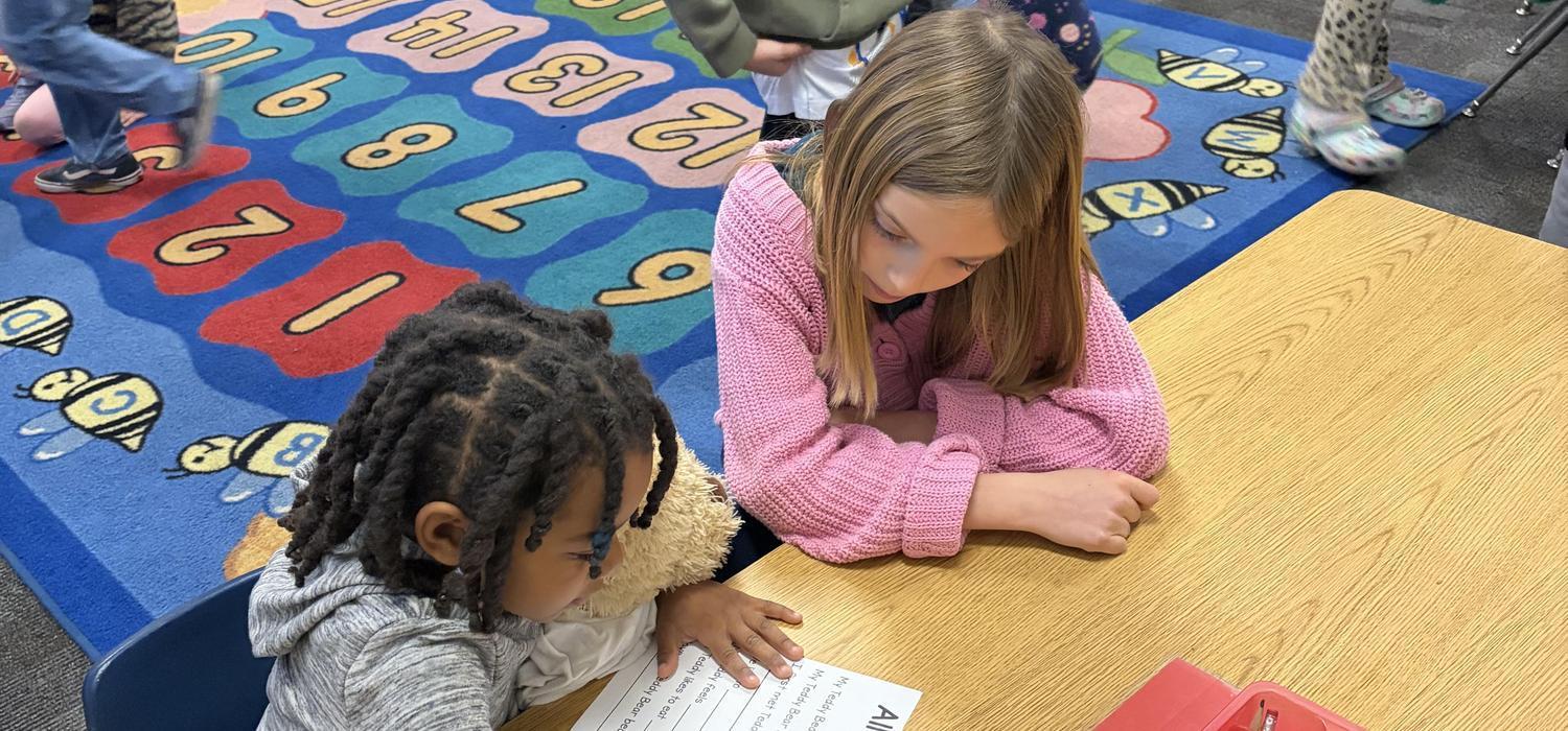 Alta Sierra 3rd grader listening to kindergardener read