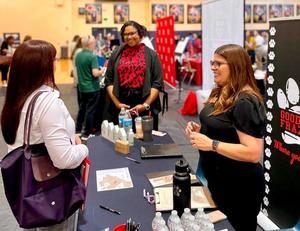 Goodwin Frazier Elementary Principal Pricelda Delgado speaks with job fair participants