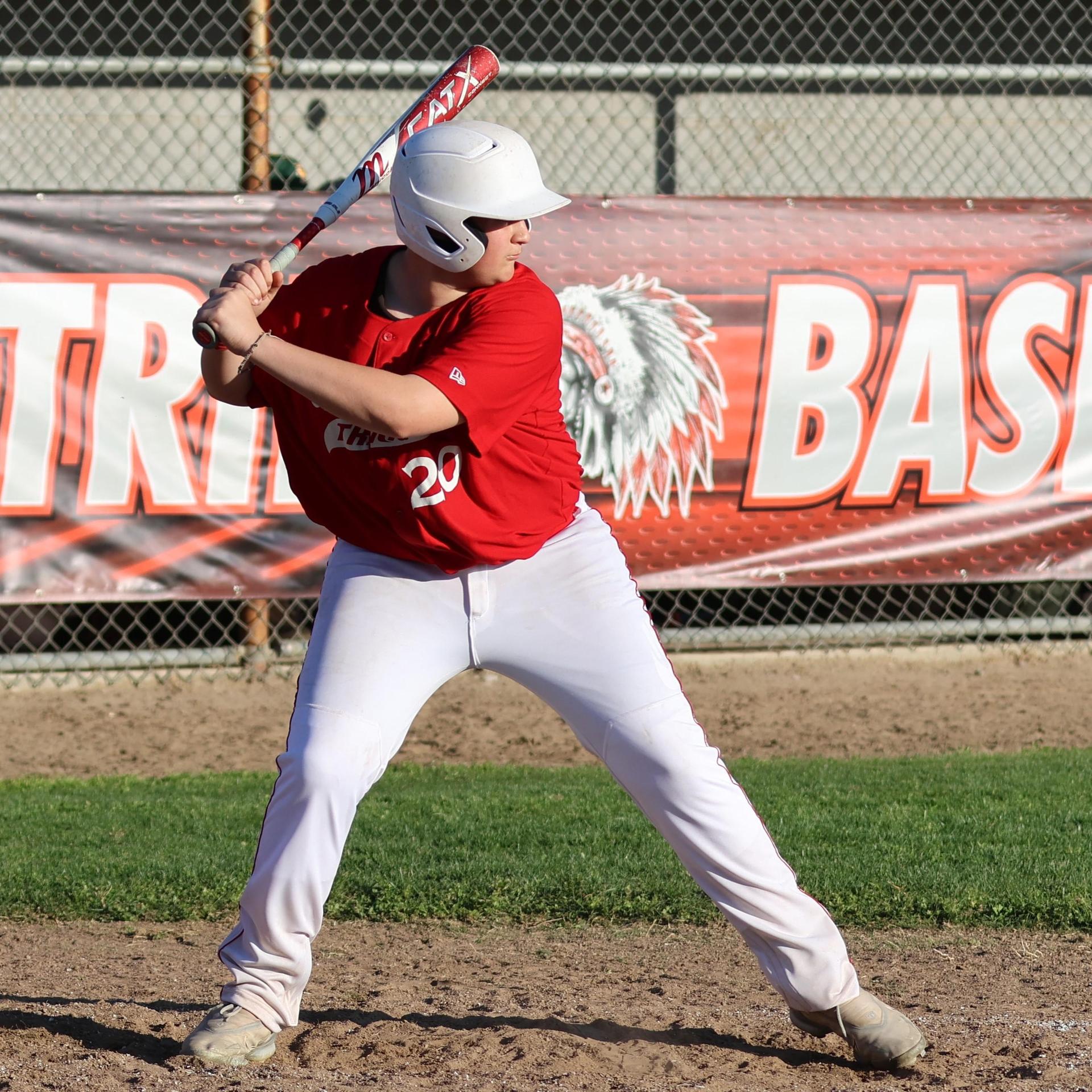 junior varsity baseball players in action