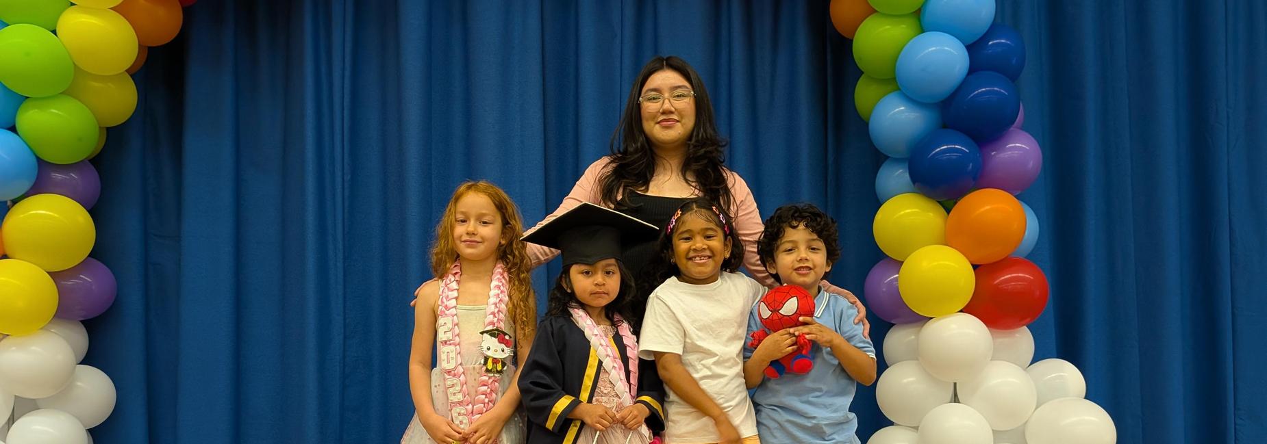 TK culmination. Children with a rainbow of balloons.