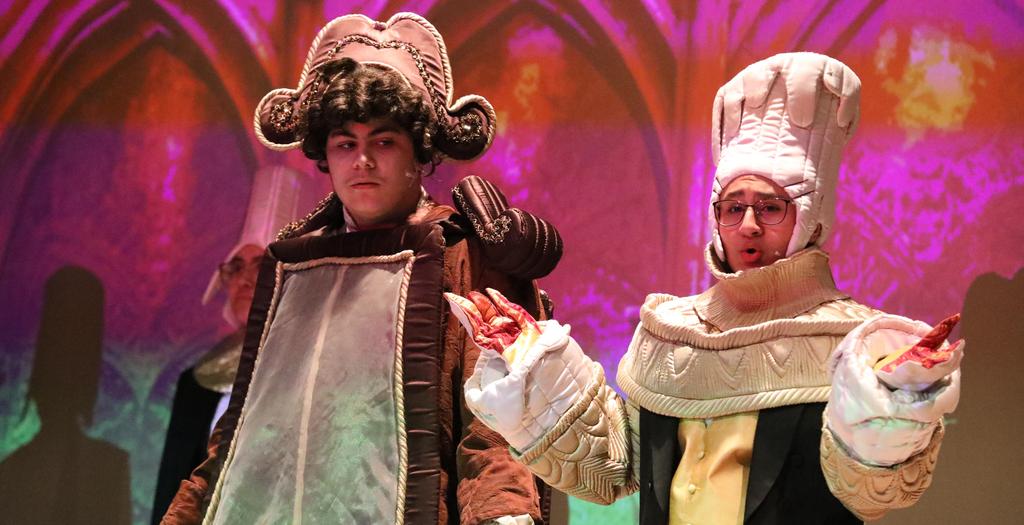 2 actors in Beauty and the Beast. One dressed as a clock the other as a candlestick