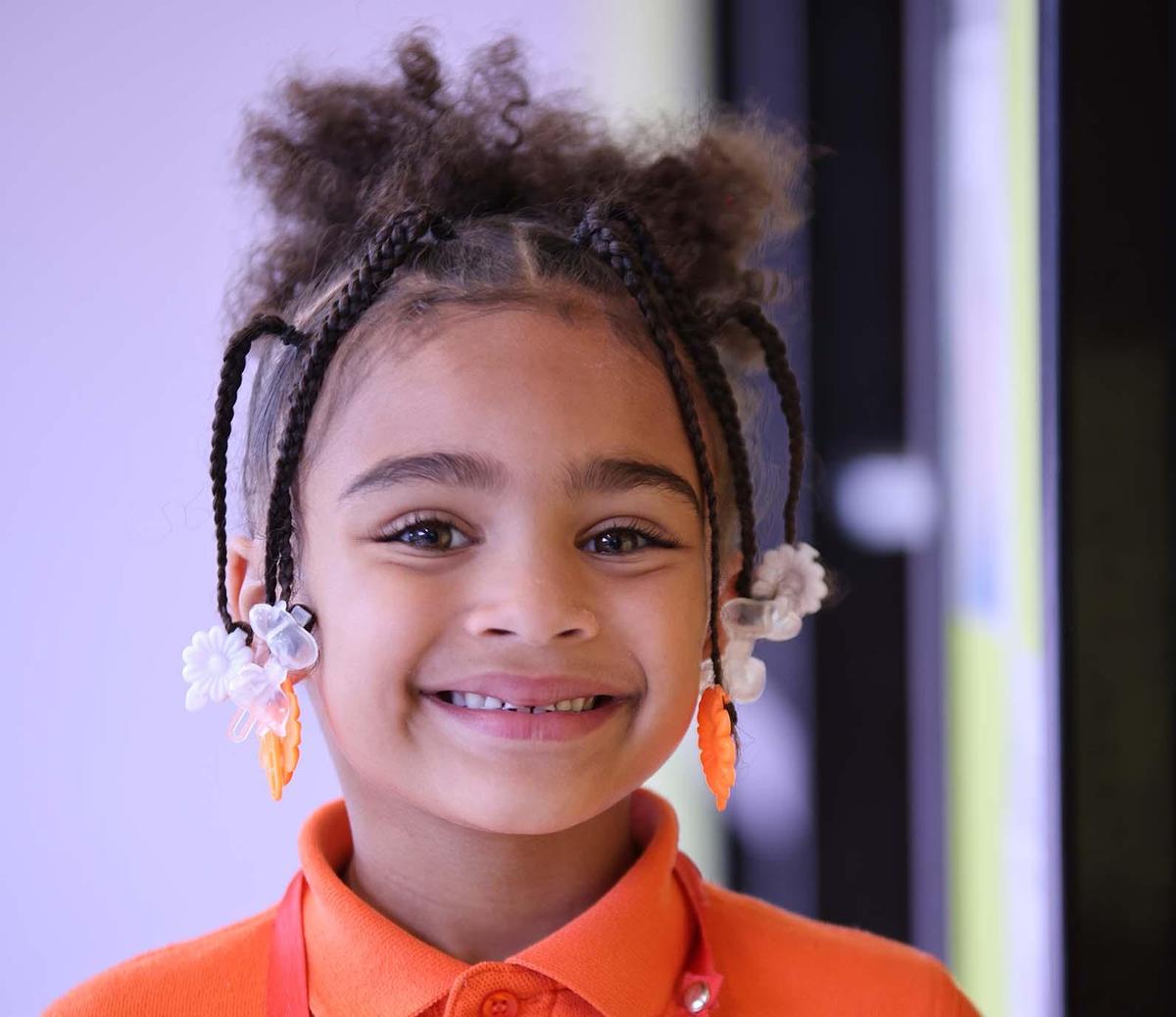 HSA Lorain South student wearing headphones uses a laptop in class