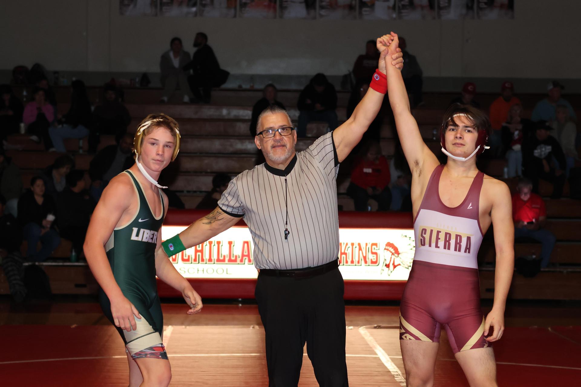 Wrestling winners with hands up 45