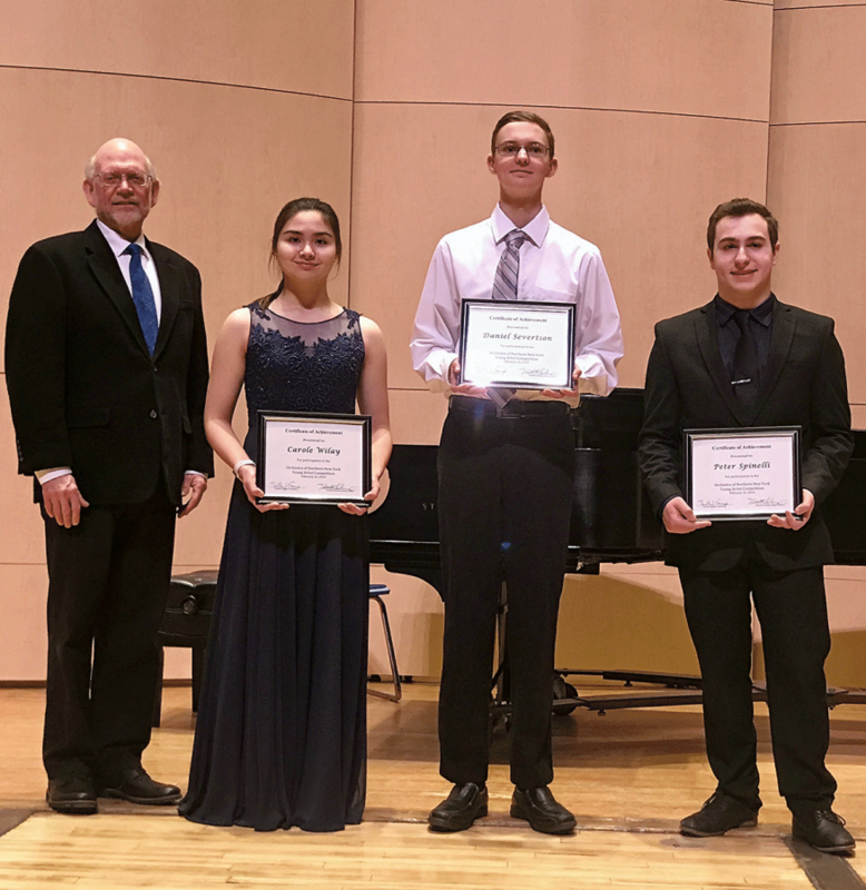 four people wearing black holding certificates
