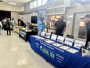 Pictured: Industry partners set up at tables for Career Week in the cafeteria