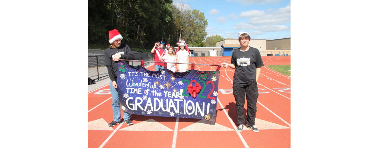 students carrying a banner