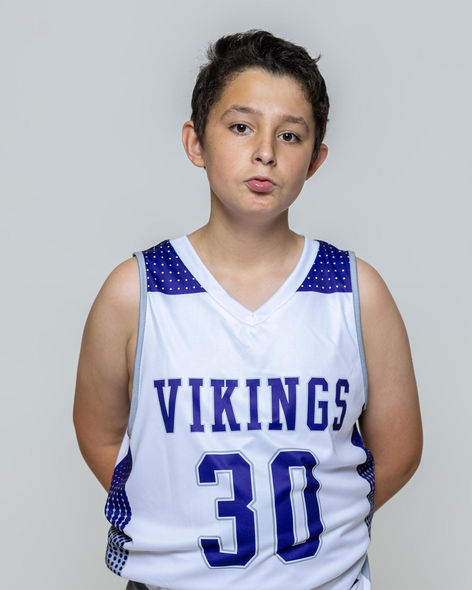 Male player number 30 posing with serious stature for a picture