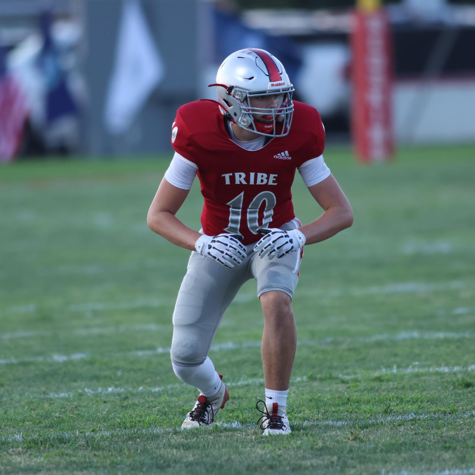 Varsity football players in action against Parlier 132