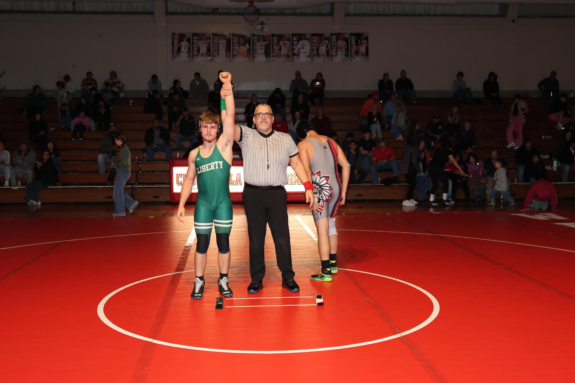 Wrestling winners with hands up 125