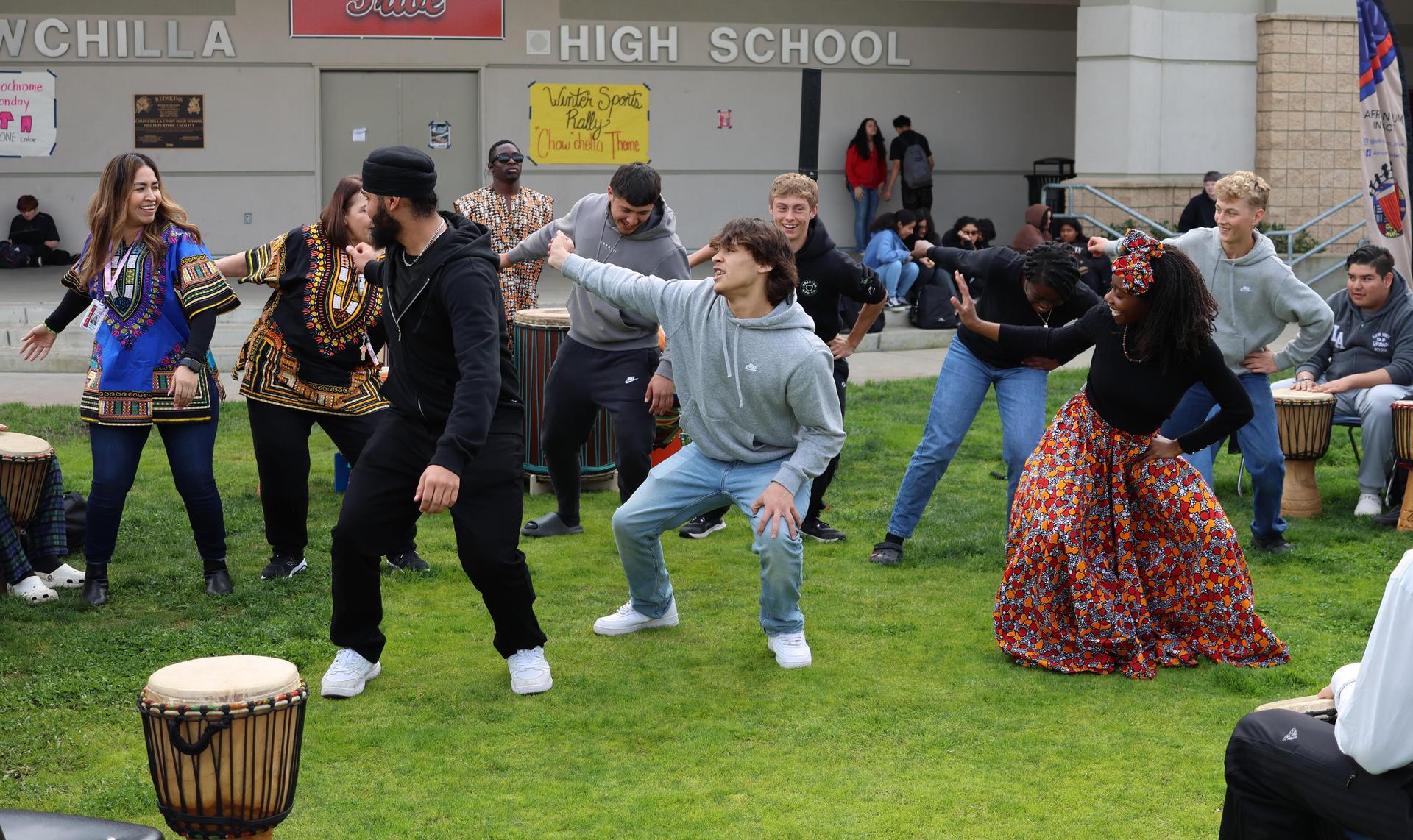 students and staff participating with the African Drum Interactive