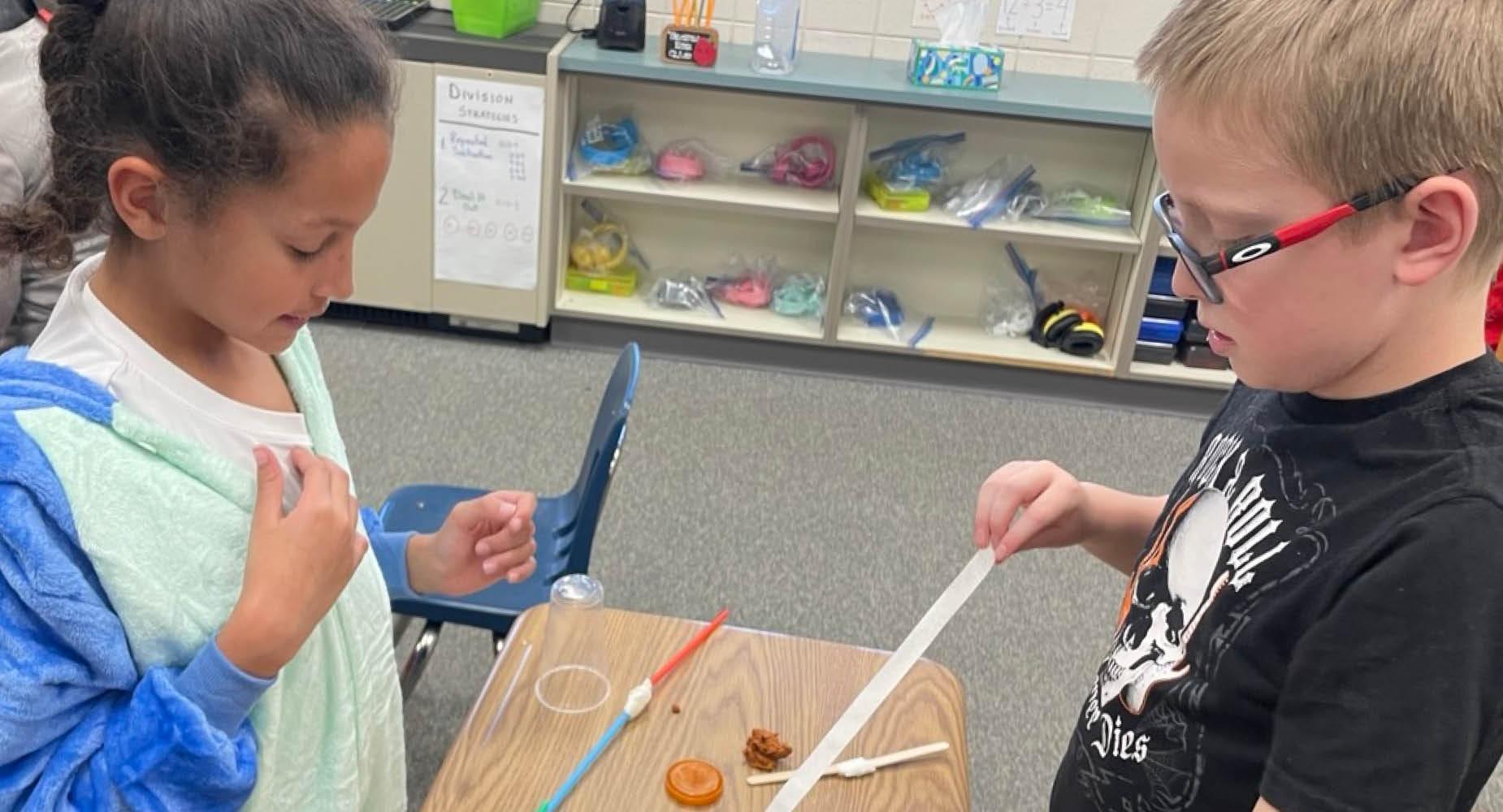 Trafford Elementary students work together on a Junkbox War project