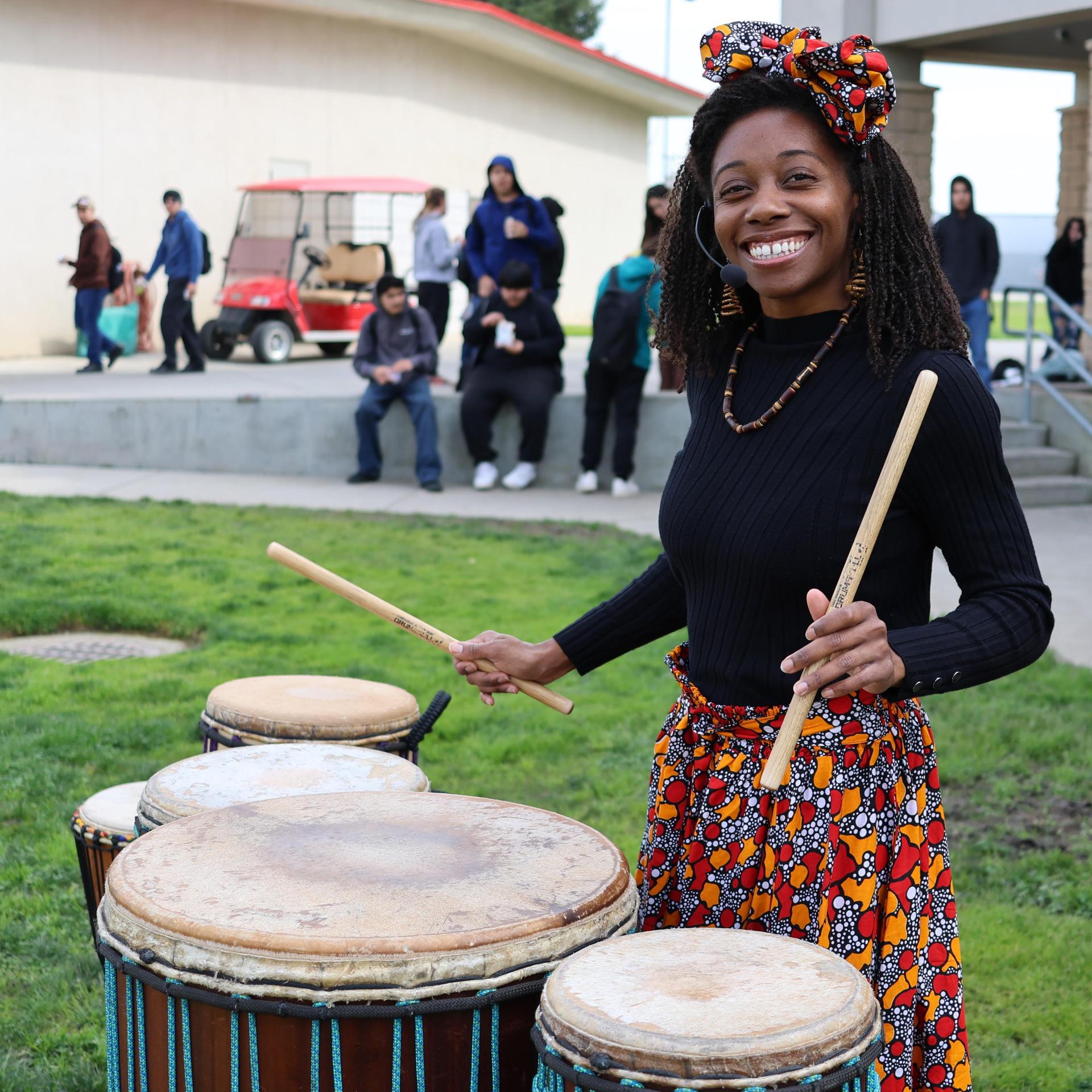 students and staff participating with the African Drum Interactive
