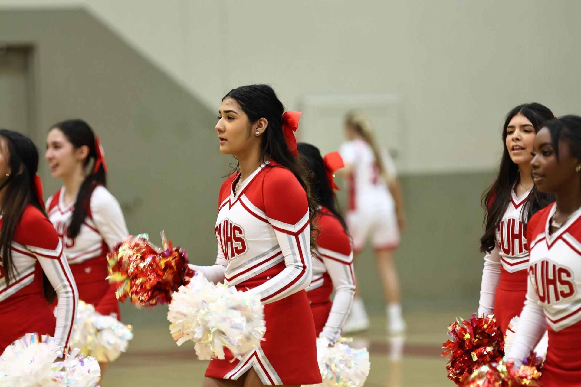 Varsity boys playing basketball against yosemite