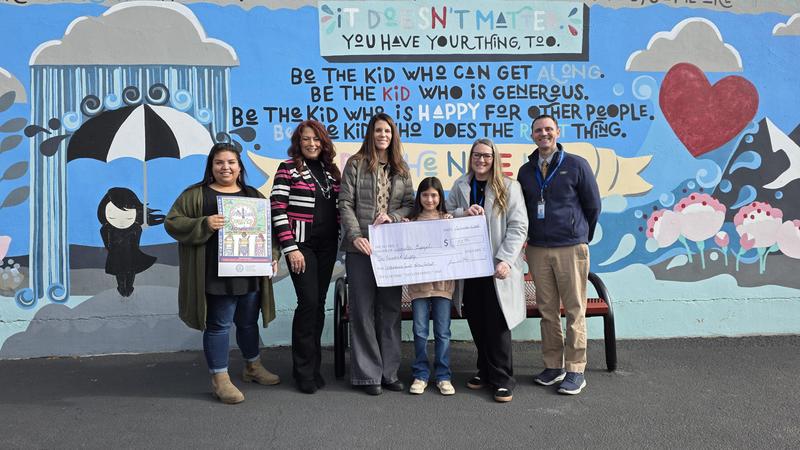 four women and one man with 4th grade girl