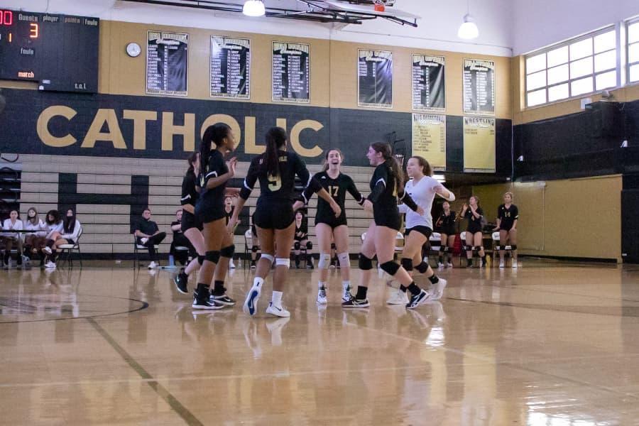 Paramus Catholic High School volleyball players celebrate.