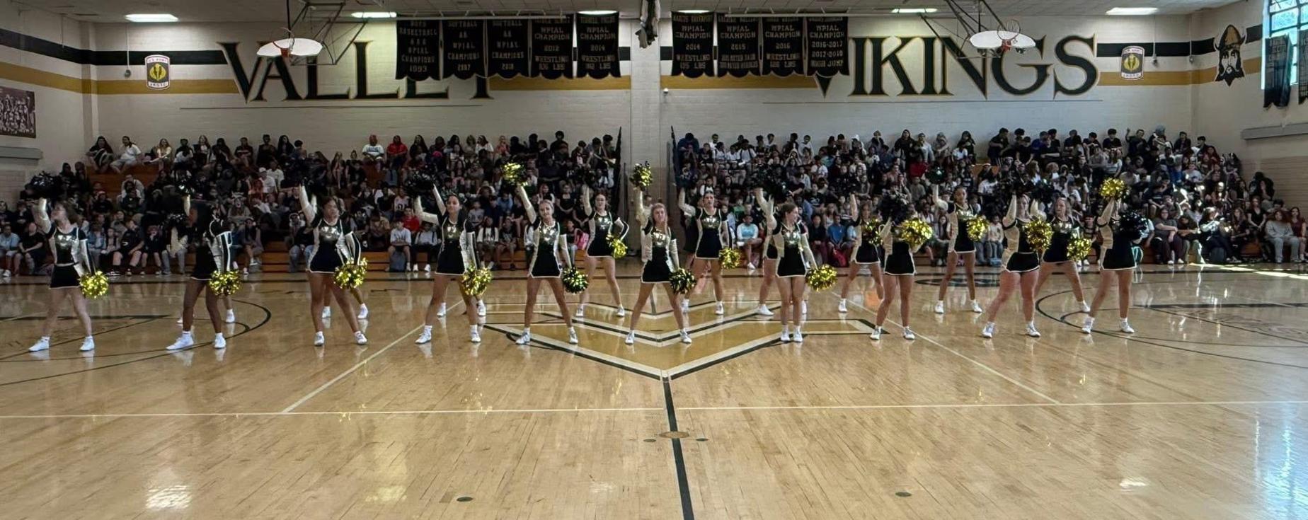 Cheerleading Squad cheering at a pep rally