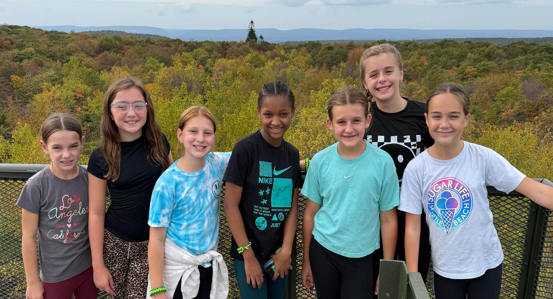 Level Green Elementary students stand at the lookout point at Deer Valley camp