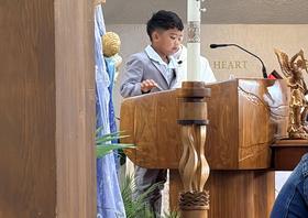 Students take part in a weekly Mass.