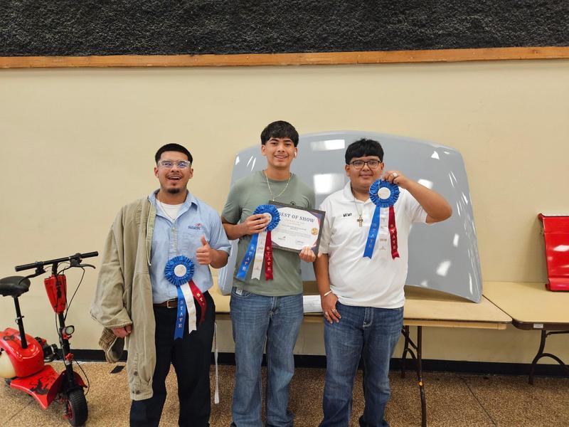THS paint, body, and collision students pose with their project at SkillsUSA State Competition