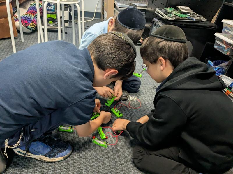 Third grade boys working with snap-circuits.