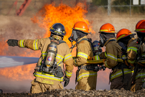 FHS Fire Academy students in action extinguishing a fire