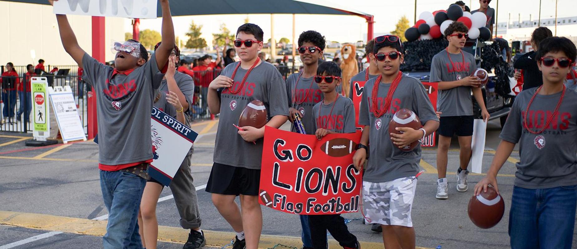 Flag football team cheers at the HoCo Parade
