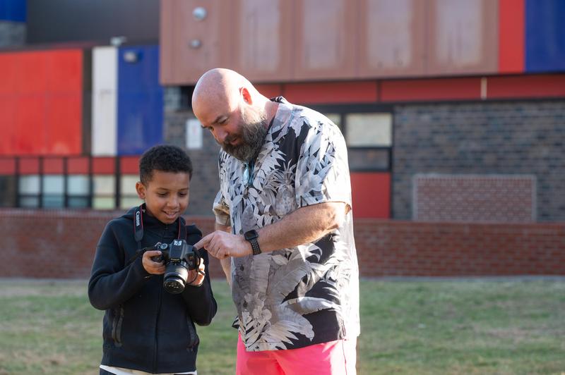 Teacher working with student