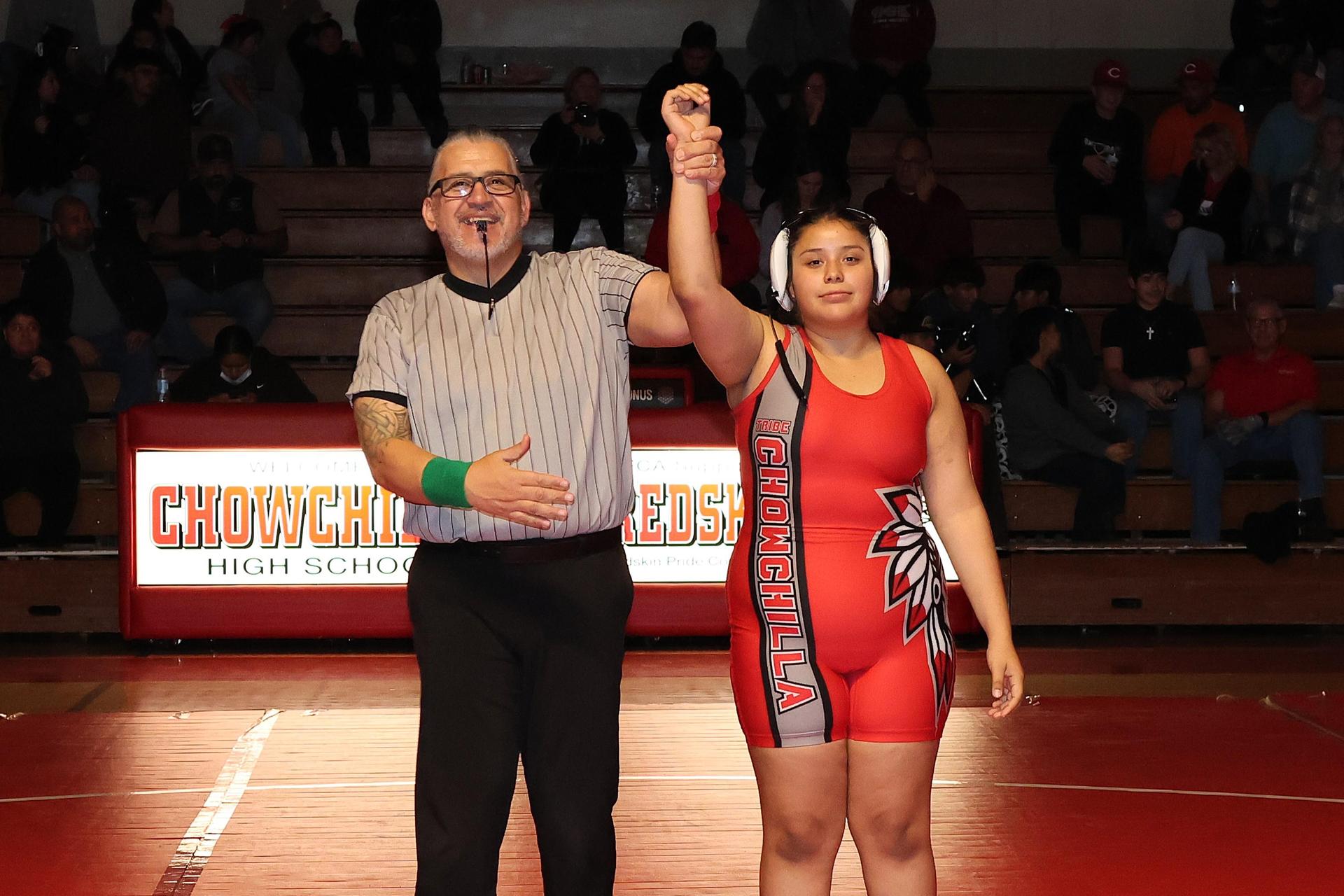 Wrestling winners with hands up 110