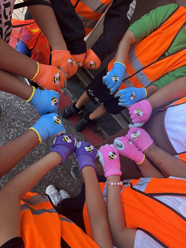 Students with their colorful gloves in preparation of cleaning  litter