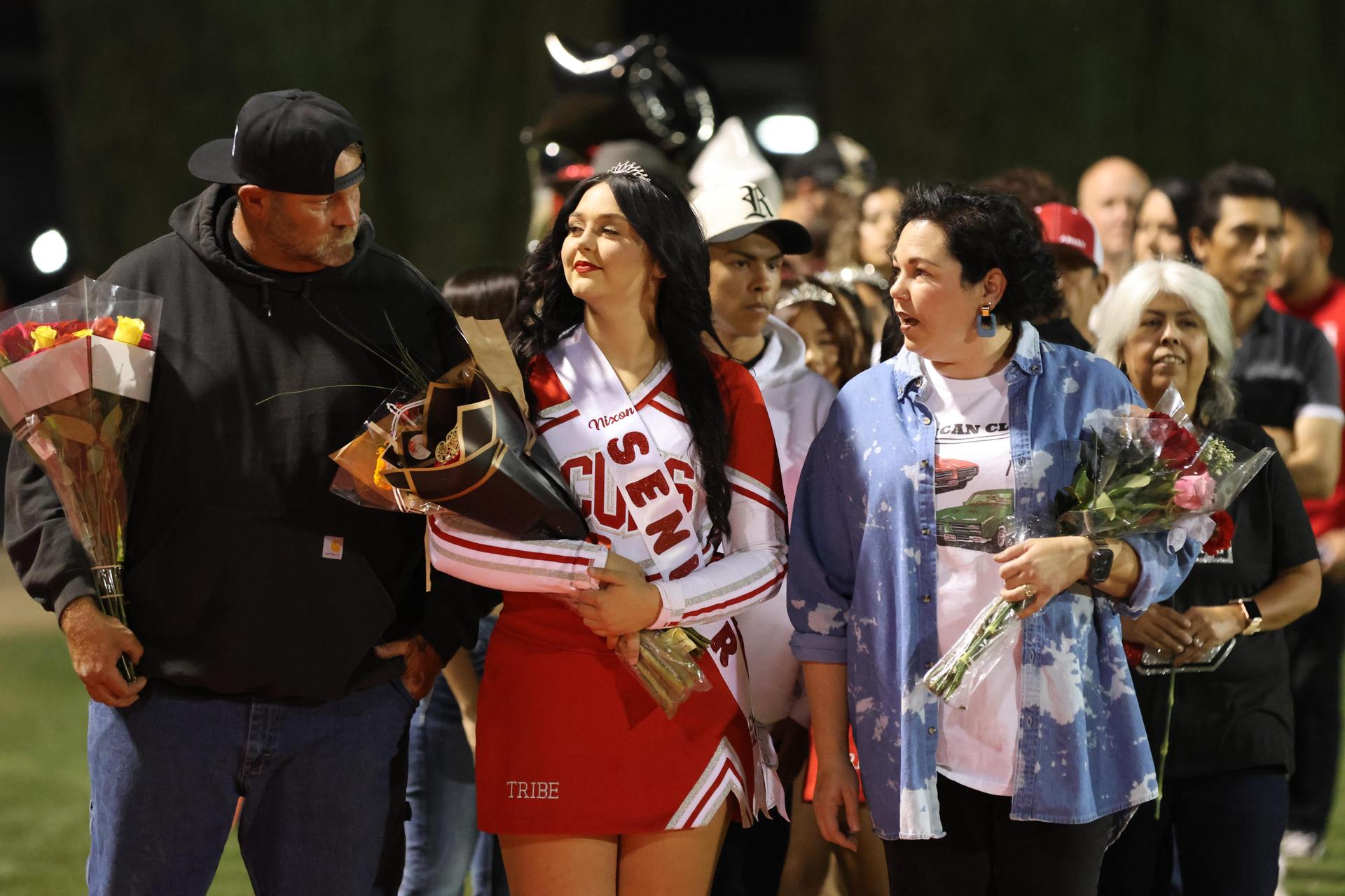 seniors and their escorts celebrating senior night