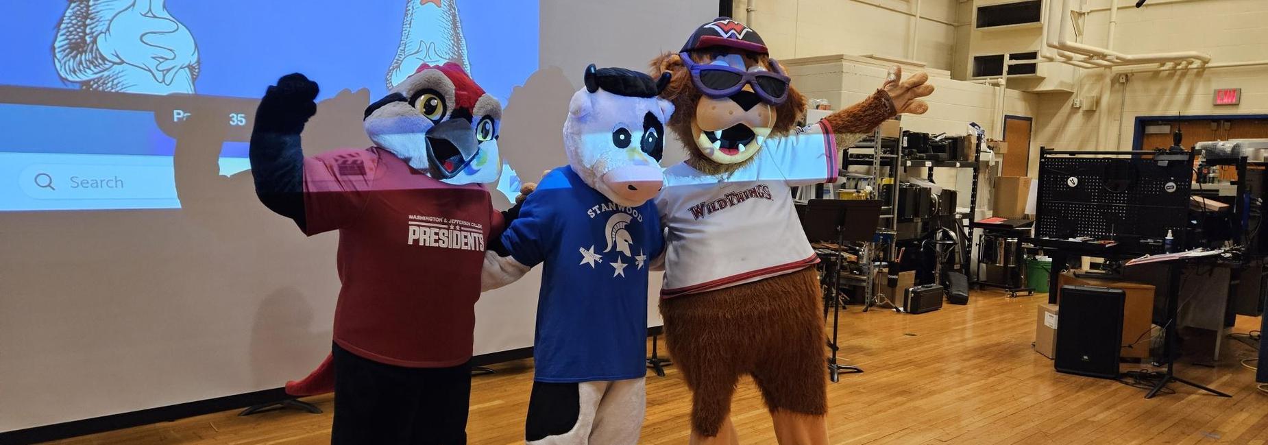 Three mascots on stage