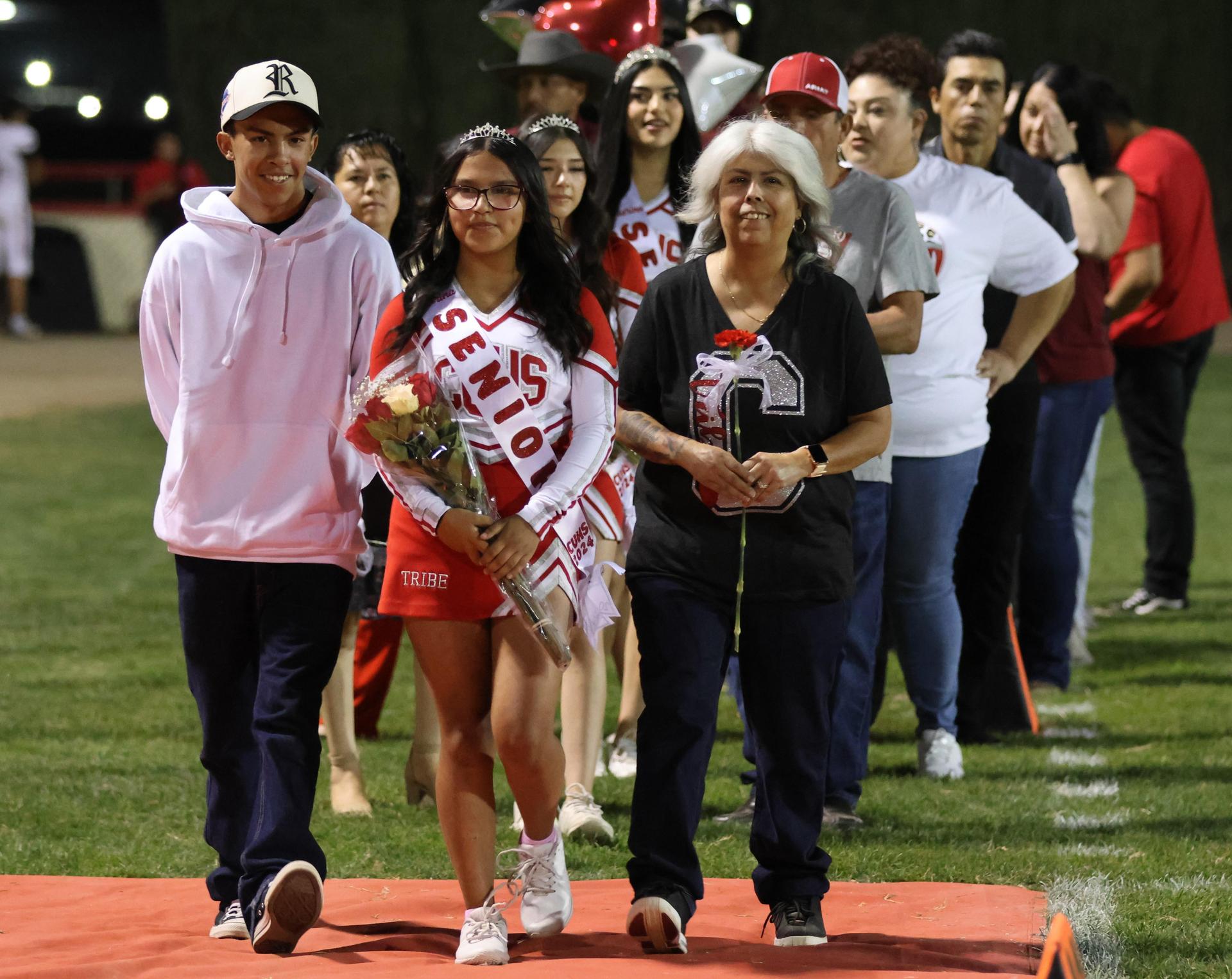 seniors and their escorts celebrating senior night