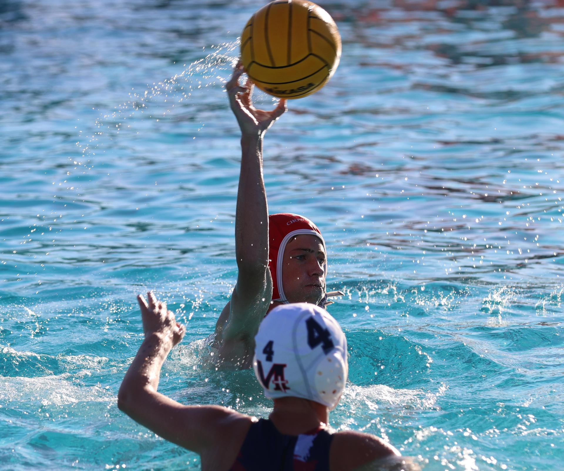 boys water polo players in action against san joaquin memorial