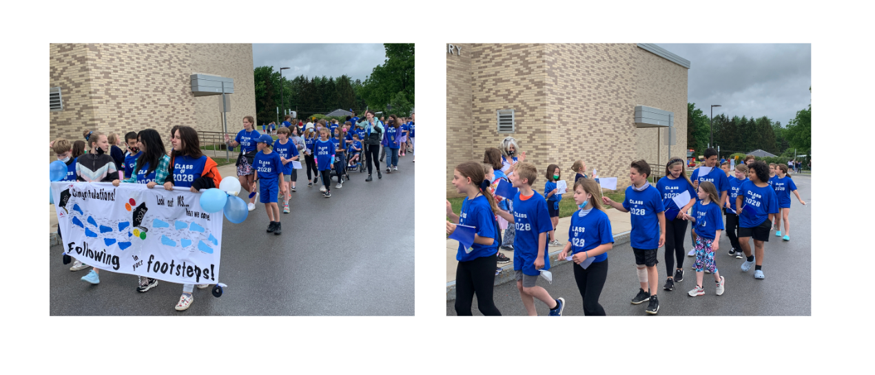 5th grade students in class of 2028 tshirts walking behind seniors