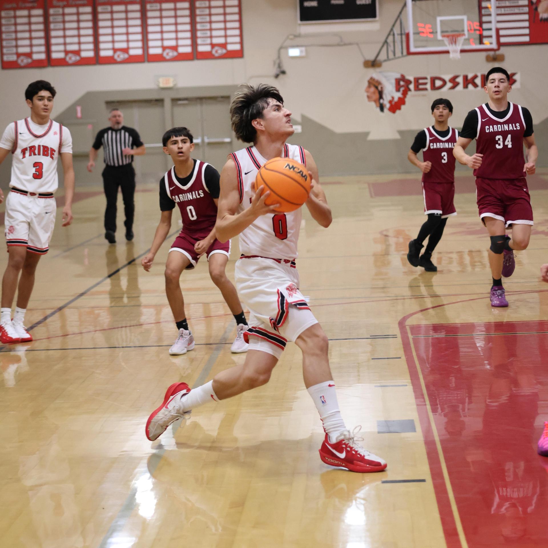 Varsity Boys Basketball playing vs. Orosi 13