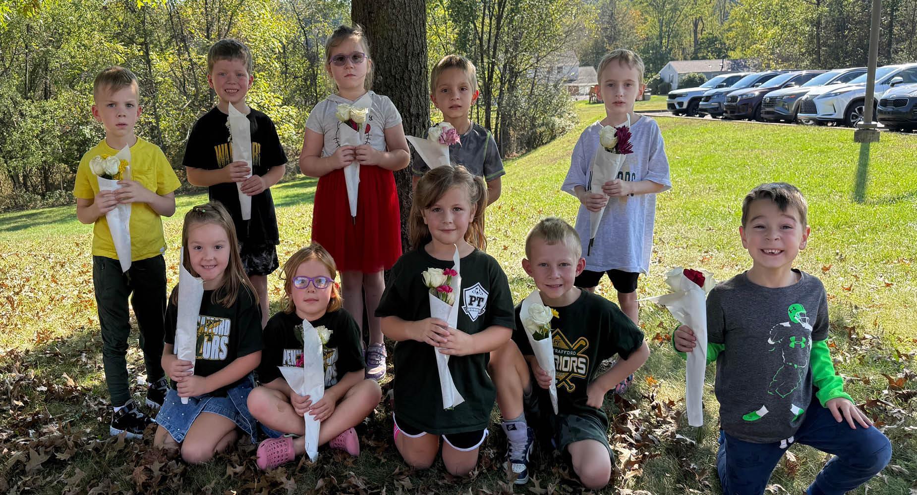 Mrs. Vovaris’s afternoon kindergarten class shows off their kindness blossom bouquets