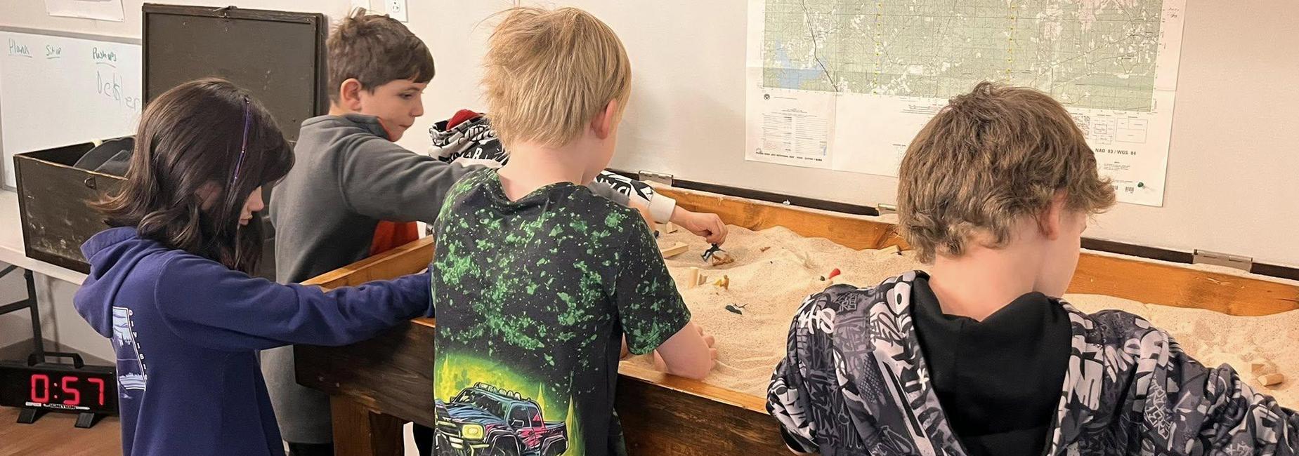 Students getting hands on learning on field trip to EO in Abingdon.