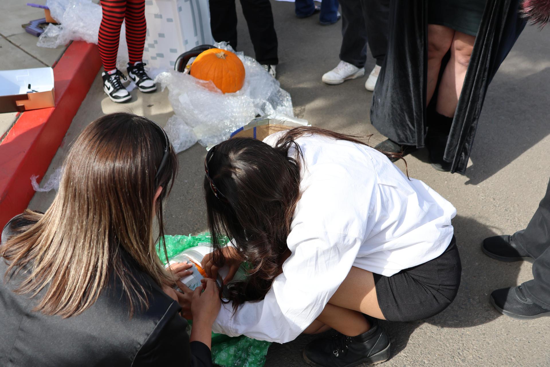 students and staff enjoying the pumpkin drop