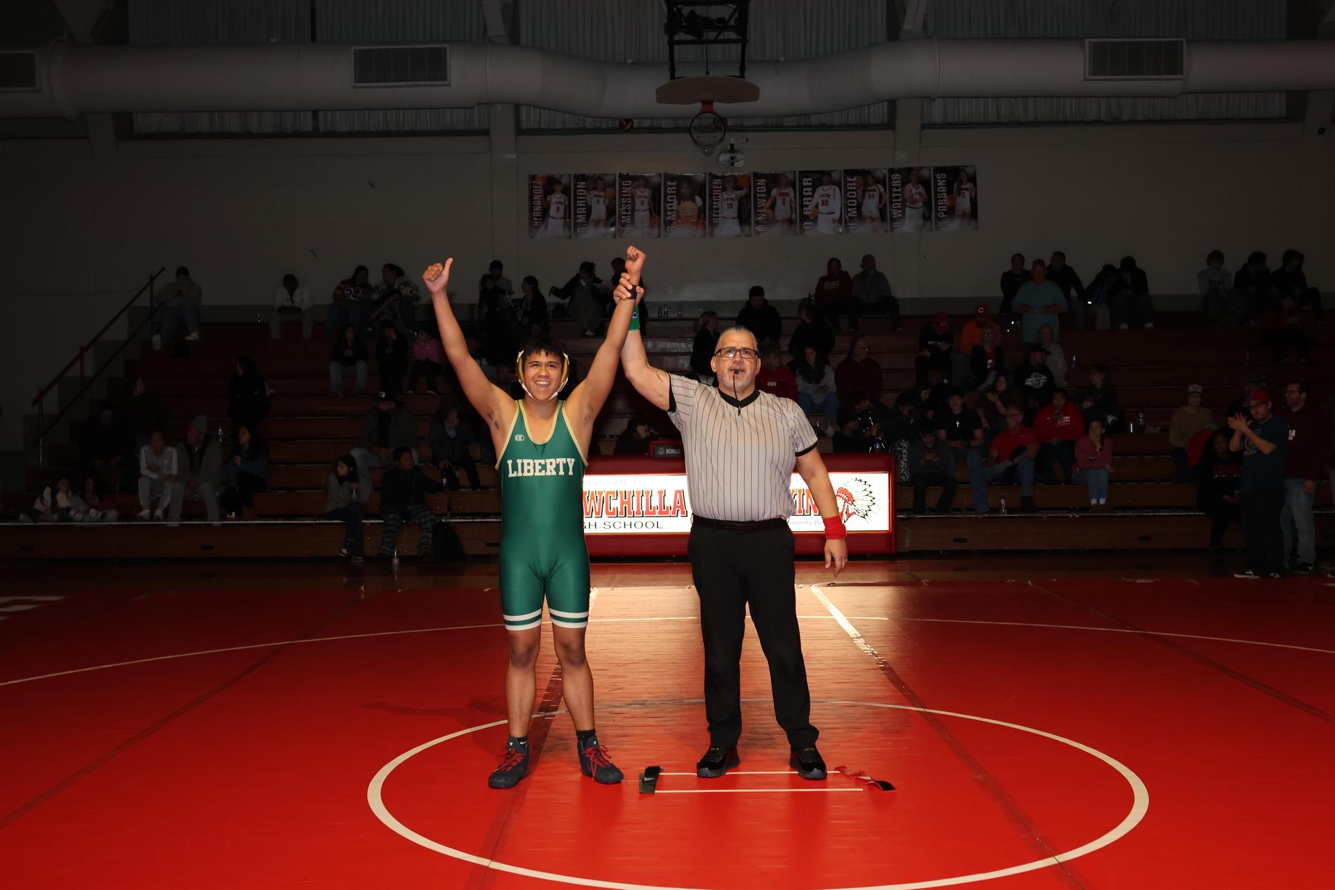 Wrestling winners with hands up 75