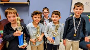 The boys in Chess Chevrah show off their trophies