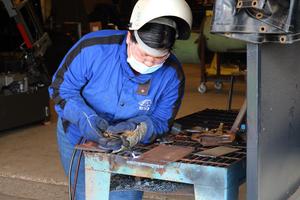 Pictured is Bianca Trevino torching metal.