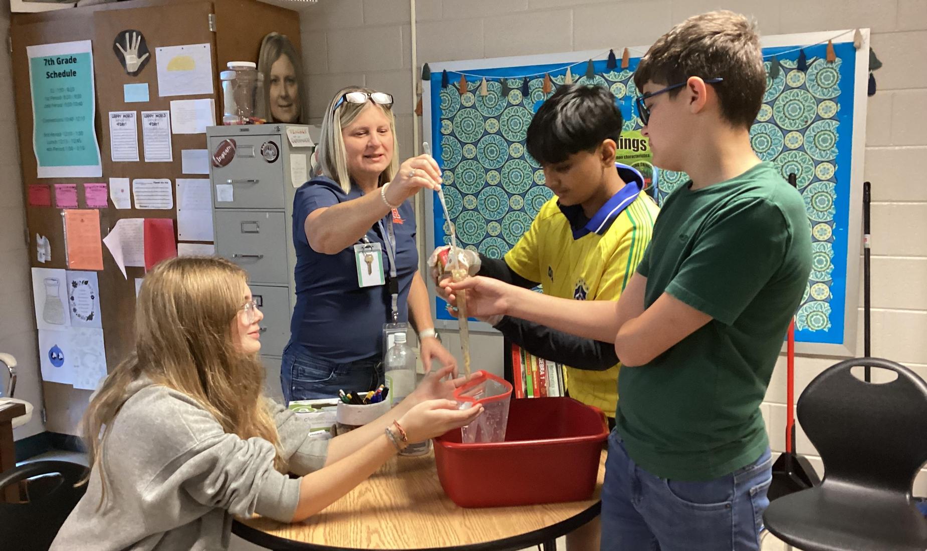 7th grade science students work on a lab.