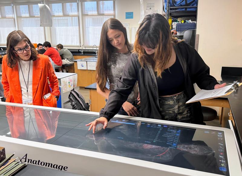 SPHS students in the Sports Medicine class interact with the Anatomage table for a lesson on vital signs while Superintendent Angela Elizondo Baxter observes (left). (Photo Courtesy of South Pasadena Unified School District)